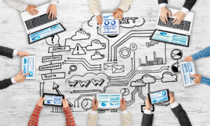 Group of people with devices in hands working together as symbol of networking and communication